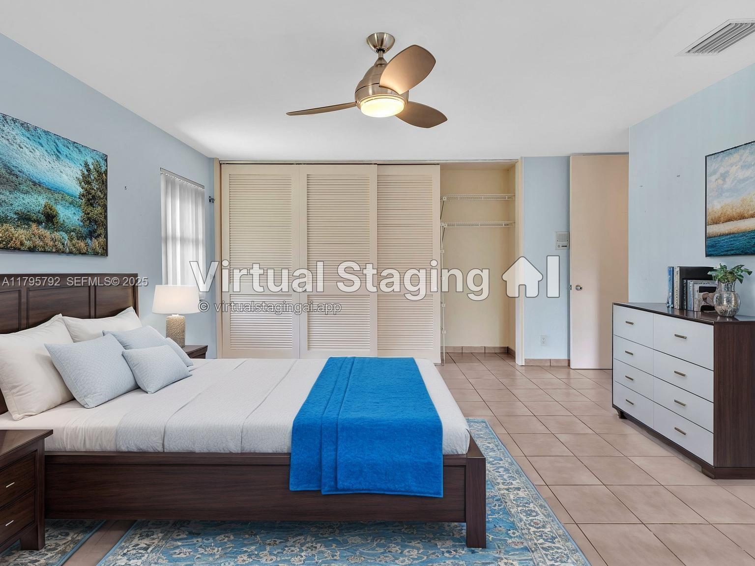 13494 Stirling Road Southwest Ranches, FL 33330 - Photo 53 of 79 a bedroom with a large bed and a chandelier