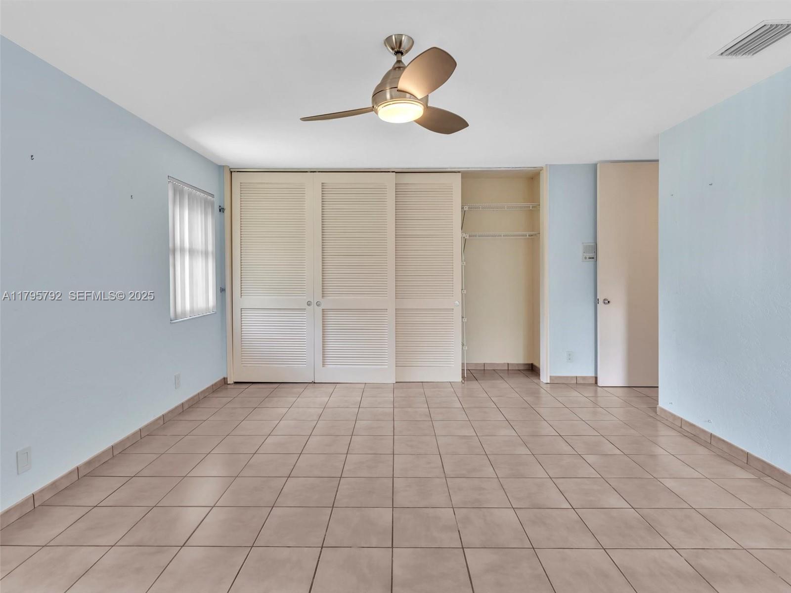 13494 Stirling Road Southwest Ranches, FL 33330 - Photo 54 of 79 an empty room with closet and windows