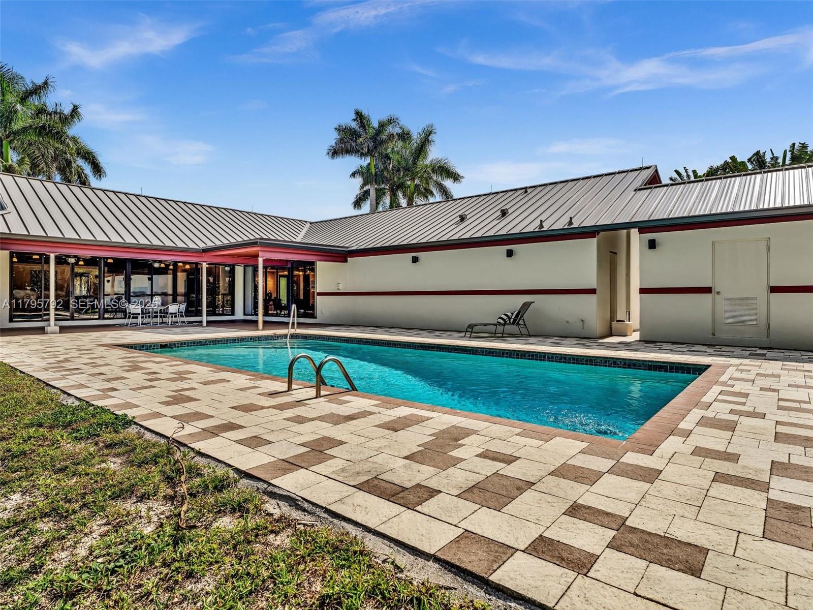 13494 Stirling Road Southwest Ranches, FL 33330 - Photo 64 of 79 a house with garden in front of it