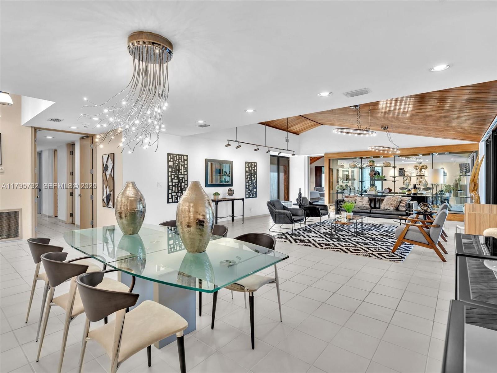 13494 Stirling Road Southwest Ranches, FL 33330 - Photo 7 of 79 a living room with furniture and a table