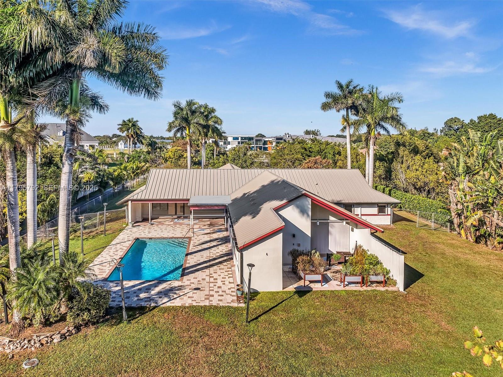 13494 Stirling Road Southwest Ranches, FL 33330 - Photo 74 of 79 an aerial view of a house with swimming pool garden and mountain view