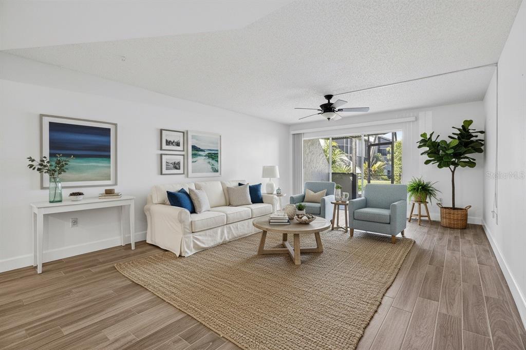 1028 Apollo Beach Boulevard, Unit 23 Apollo Beach, FL 33572 - Photo 20 of 86 a living room with furniture and a large window