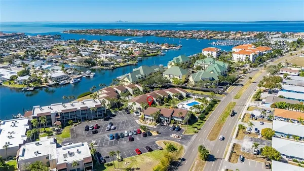 an aerial view of a house with a ocean view