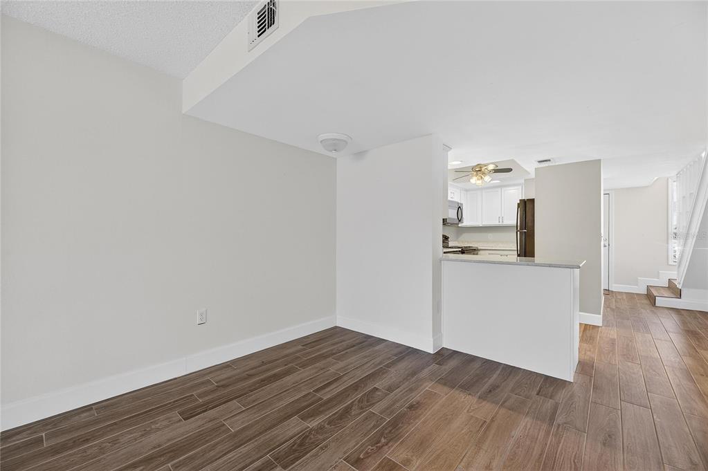 1028 Apollo Beach Boulevard, Unit 23 Apollo Beach, FL 33572 - Photo 24 of 86 a view of a kitchen with wooden floor