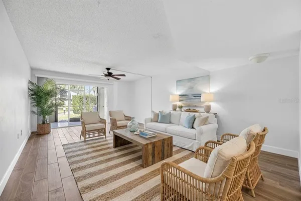 an empty room with closet and a chandelier fan