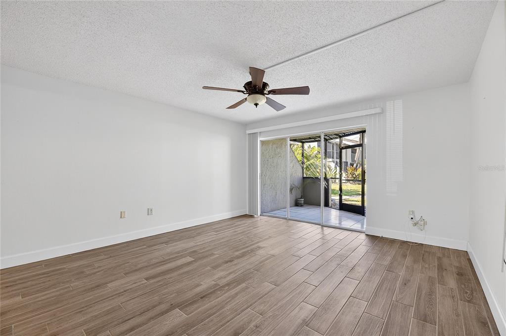 1028 Apollo Beach Boulevard, Unit 23 Apollo Beach, FL 33572 - Photo 31 of 86 wooden floor in an empty room with a window
