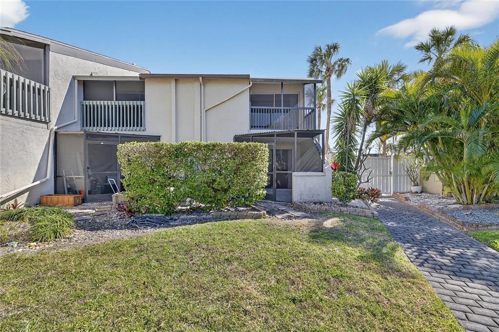 1028 Apollo Beach Boulevard, Unit 23 Apollo Beach, FL 33572 - Photo 39 of 86 front view of a house with a garden