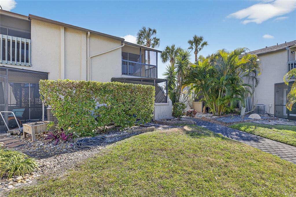1028 Apollo Beach Boulevard, Unit 23 Apollo Beach, FL 33572 - Photo 40 of 86 a front view of a house with garden