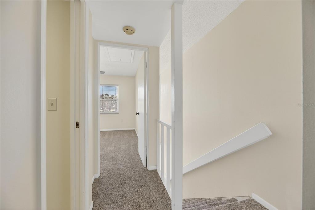 1028 Apollo Beach Boulevard, Unit 23 Apollo Beach, FL 33572 - Photo 44 of 86 a view of a hallway with wooden floor