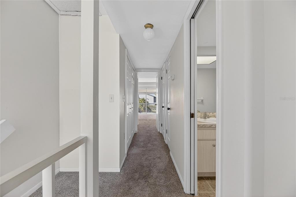 1028 Apollo Beach Boulevard, Unit 23 Apollo Beach, FL 33572 - Photo 45 of 86 a view of a hallway with a livingroom and a bathroom with sink