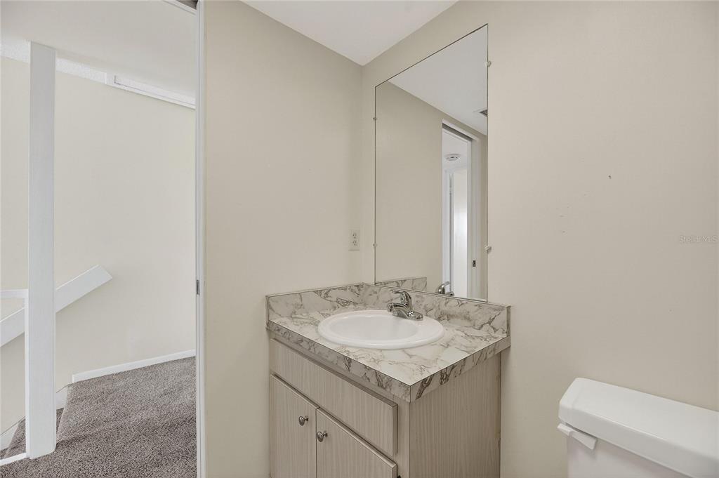 1028 Apollo Beach Boulevard, Unit 23 Apollo Beach, FL 33572 - Photo 51 of 86 a bathroom with a sink toilet and a mirror