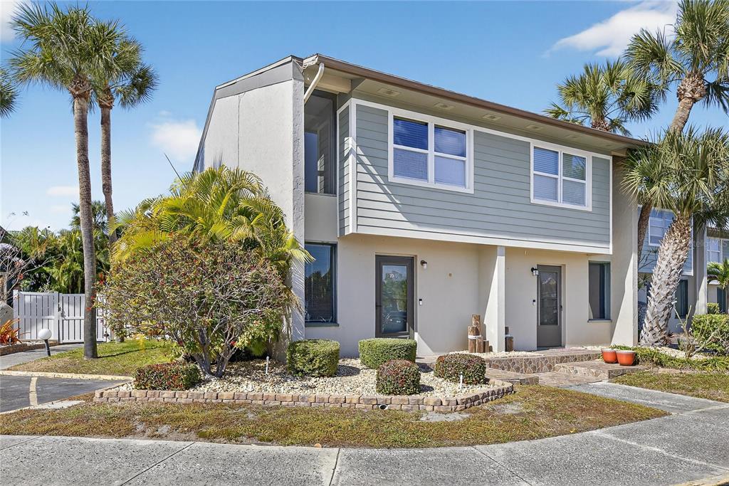 1028 Apollo Beach Boulevard, Unit 23 Apollo Beach, FL 33572 - Photo 7 of 86 a front view of a house with garden and plants