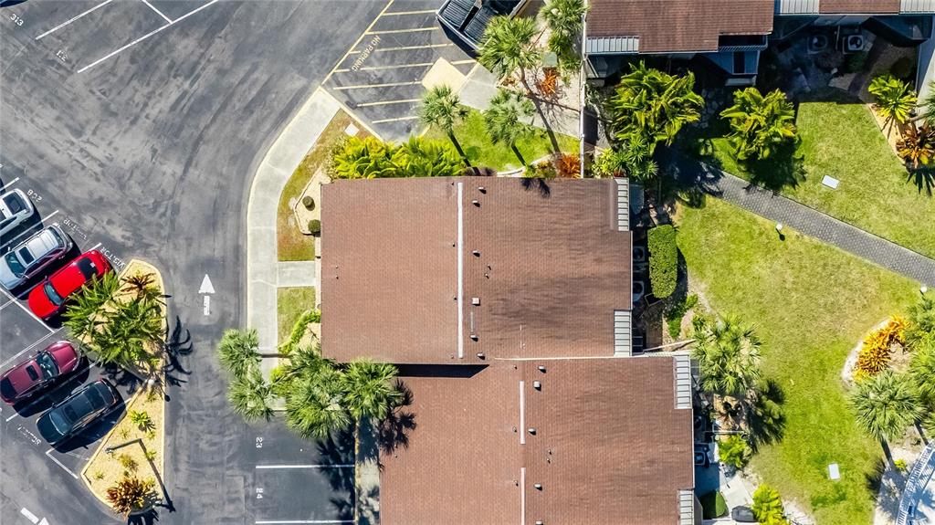1028 Apollo Beach Boulevard, Unit 23 Apollo Beach, FL 33572 - Photo 81 of 86 an aerial view of a house with a yard and a fountain