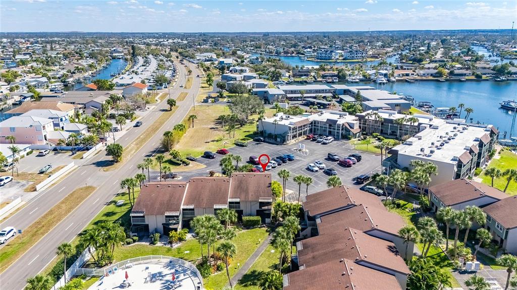 1028 Apollo Beach Boulevard, Unit 23 Apollo Beach, FL 33572 - Photo 84 of 86 an aerial view of a house with a lake view