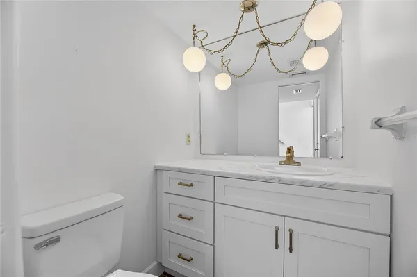 a kitchen with cabinets appliances a sink and a counter top