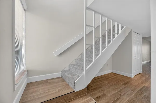 wooden floor in an empty room with window