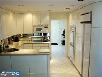 51 Tulip Road Southampton, PA 18966 - Photo 4 of 12 a kitchen with a refrigerator and a sink