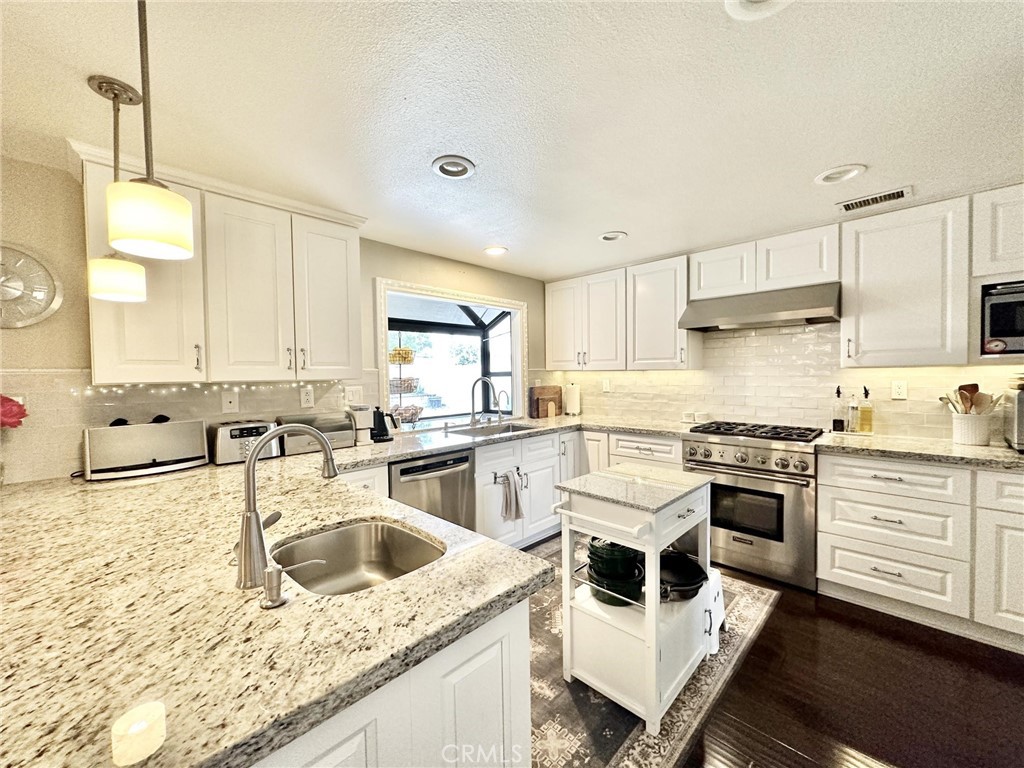 2138 Clear Springs Road Brea, CA 92821 - Photo 8 of 10 a kitchen with a stove a sink and a refrigerator