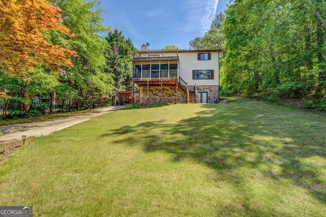 an aerial view of a house with a lake view