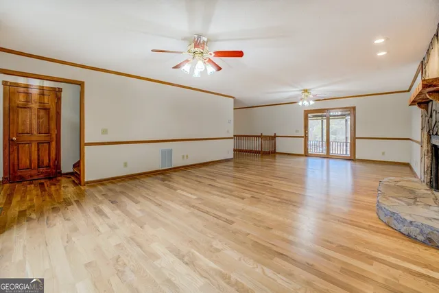 a kitchen with stainless steel appliances granite countertop a sink and a window