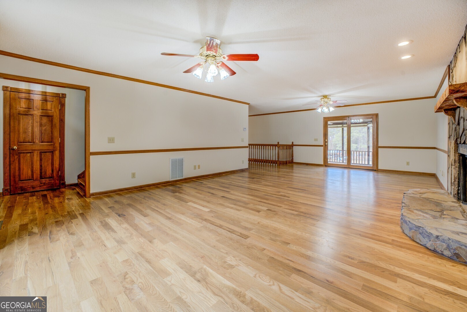 71 Canvasback Court Monticello, GA 31064 - Photo 21 of 79 a view of empty room with wooden floor
