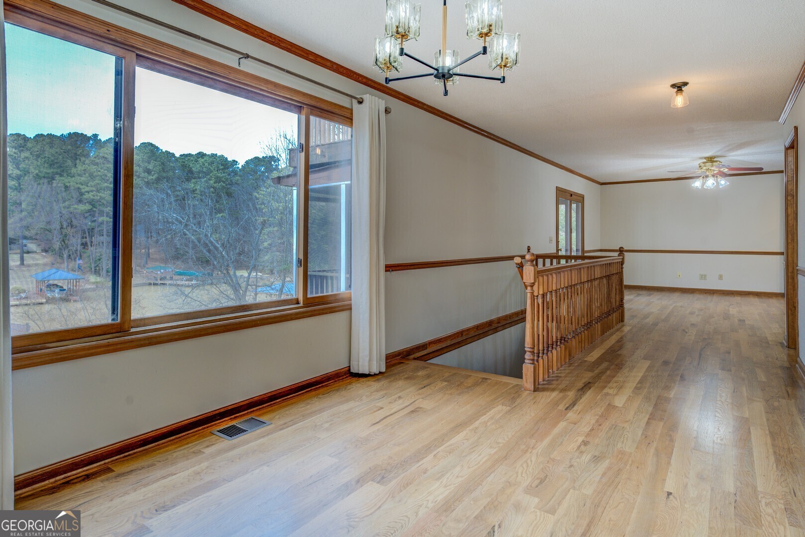 71 Canvasback Court Monticello, GA 31064 - Photo 27 of 79 a view of a room with wooden floor and windows