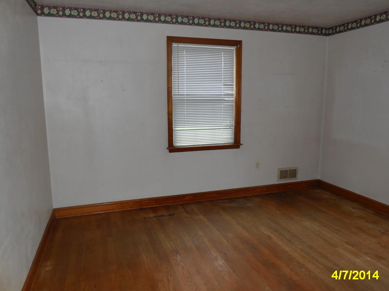 3816 Cove Road Roanoke, VA 24017 - Photo 9 of 9 a view of a small space with wooden floor and a window