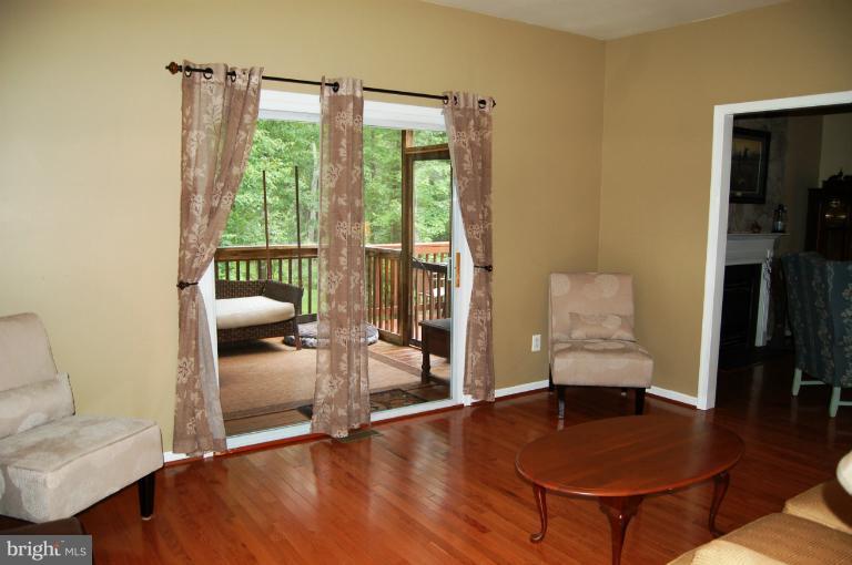 3885 Dumfries Road Catlett, VA 20119 - Photo 20 of 29 Living Room with Door Leading to Screend Porch