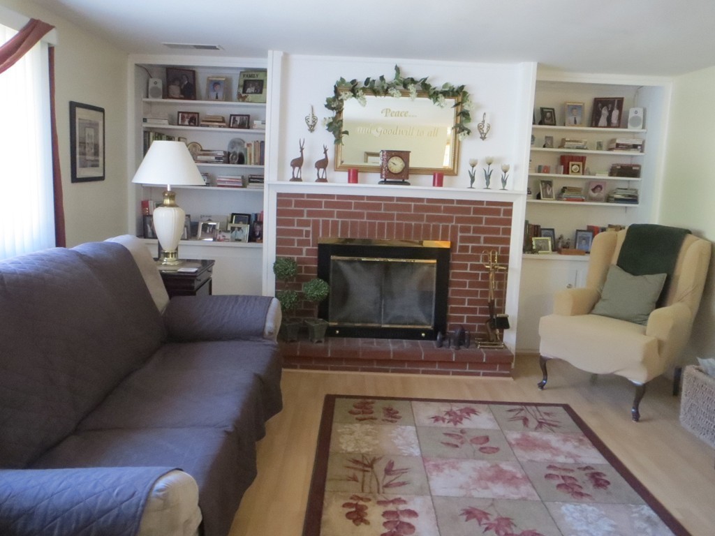 84 Genesee Street Lawrence, MA 01843 - Photo 12 of 30 a living room with furniture and a fireplace
