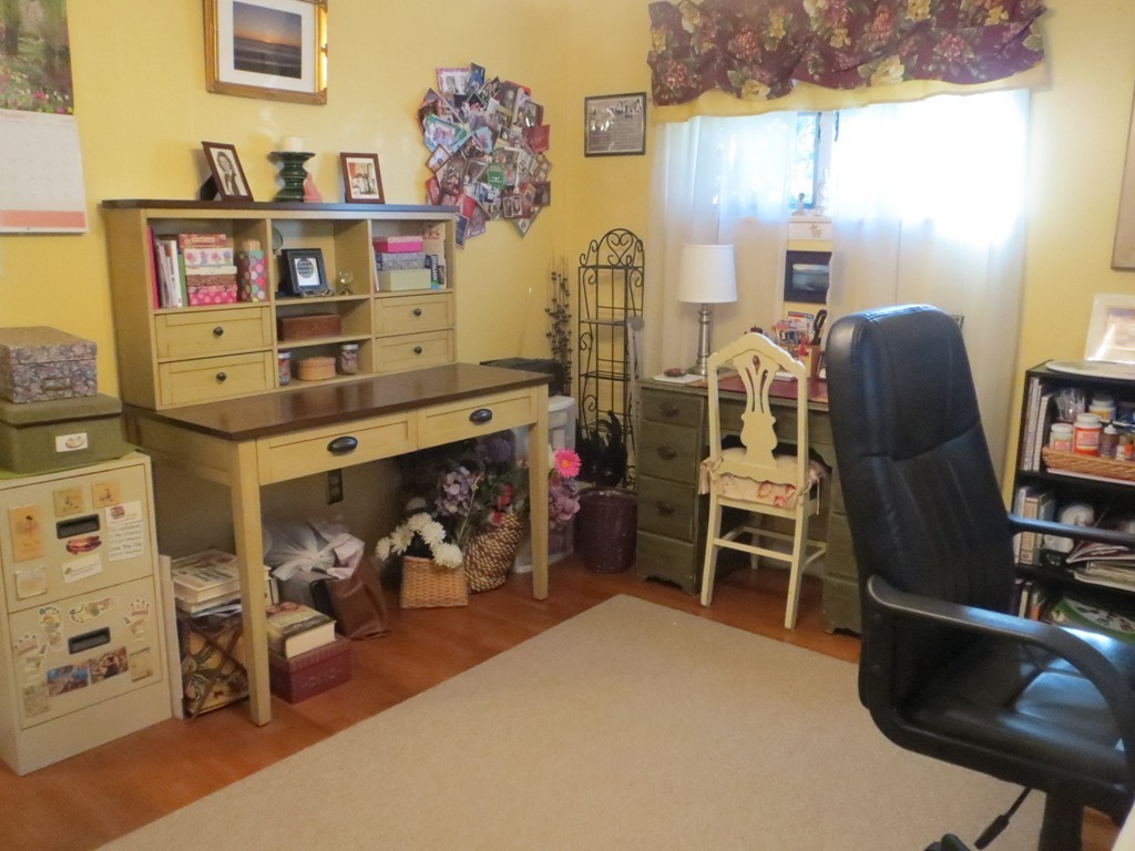 84 Genesee Street Lawrence, MA 01843 - Photo 15 of 30 a bed room with a bed and a chair