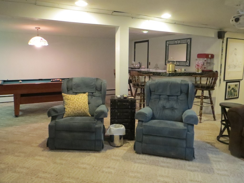 84 Genesee Street Lawrence, MA 01843 - Photo 18 of 30 a living room with furniture and a wooden floor
