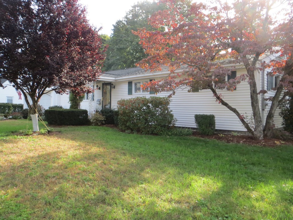 84 Genesee Street Lawrence, MA 01843 - Photo 2 of 30 a view of a house with a backyard