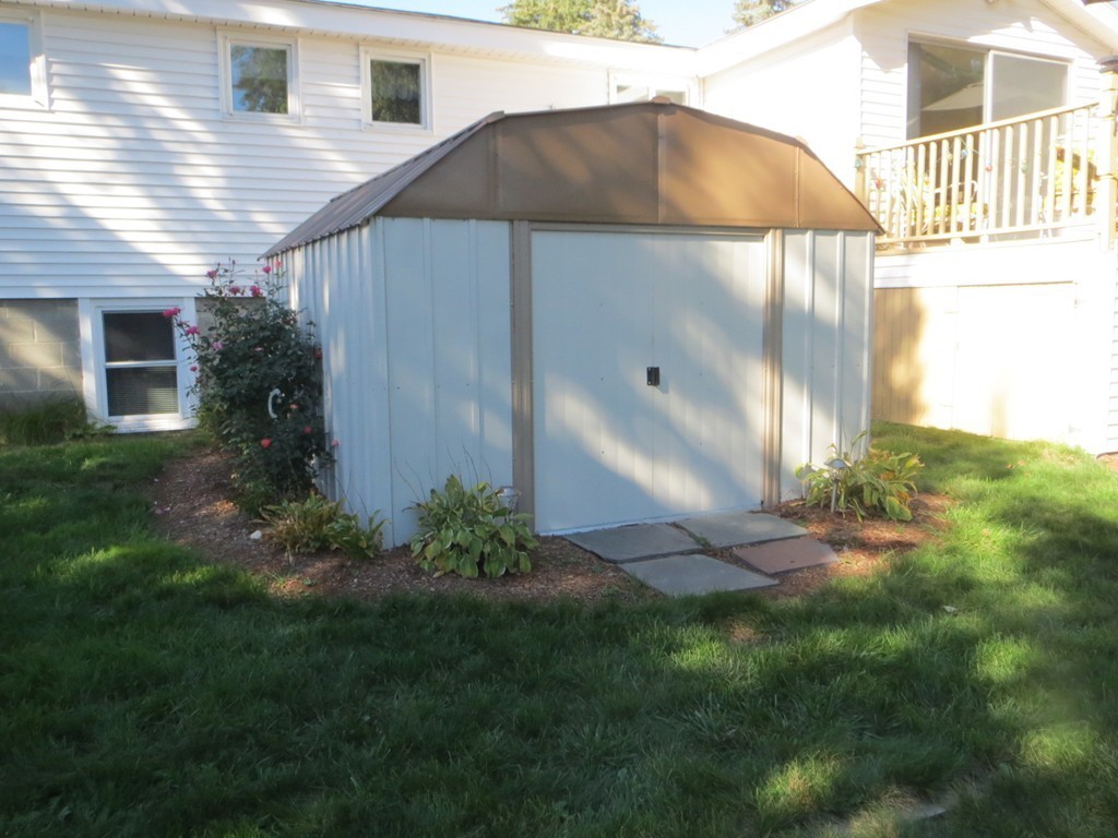 84 Genesee Street Lawrence, MA 01843 - Photo 23 of 30 a backyard of a house with lots of green space
