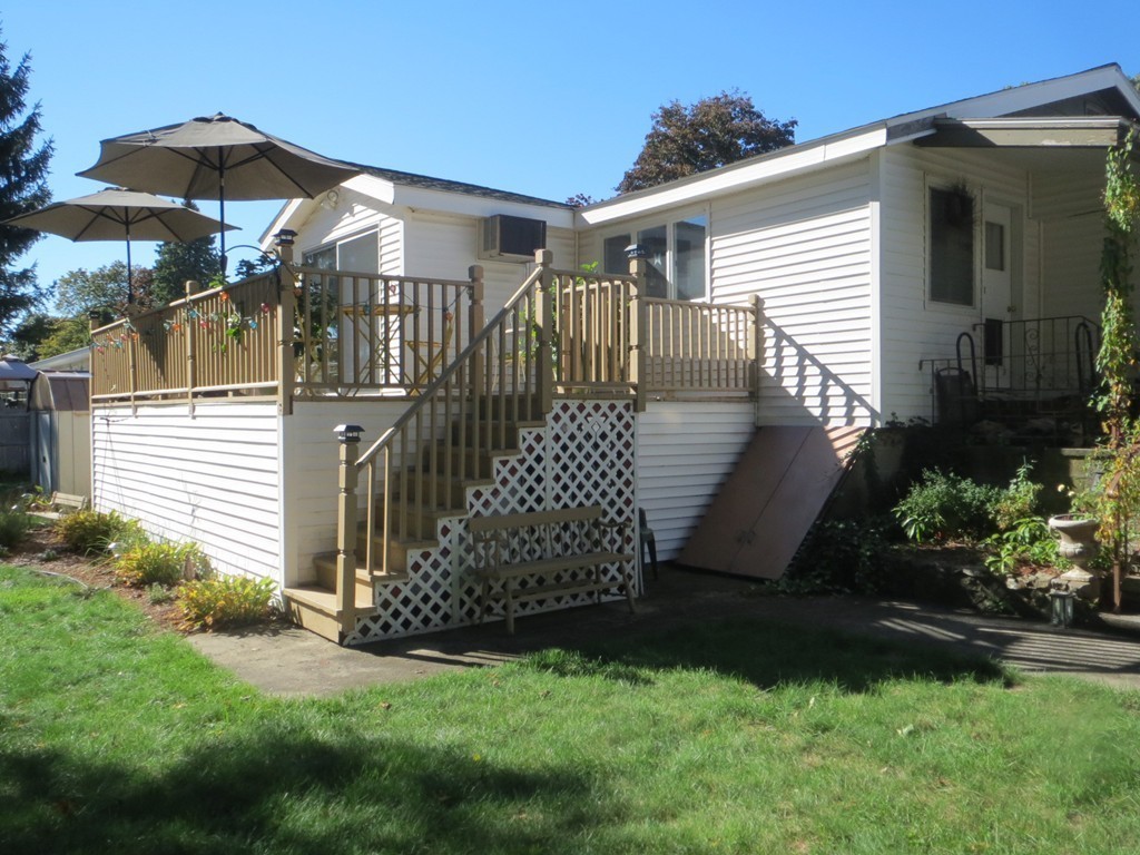 84 Genesee Street Lawrence, MA 01843 - Photo 26 of 30 a view of a house with a yard and plants