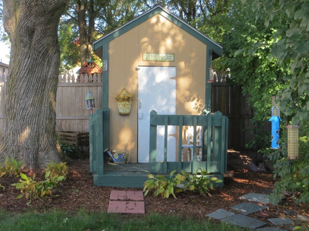 84 Genesee Street Lawrence, MA 01843 - Photo 27 of 30 a front view of a house with a yard