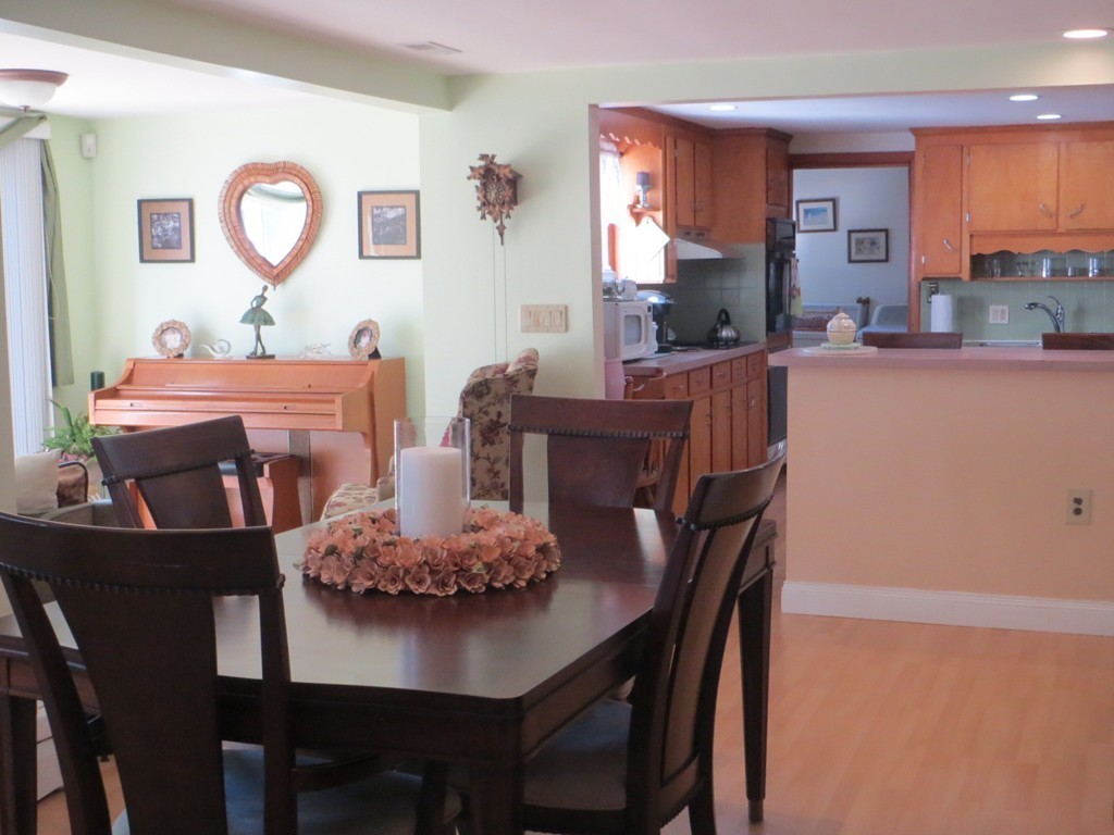 84 Genesee Street Lawrence, MA 01843 - Photo 9 of 30 a view of a dining room with furniture and a kitchen