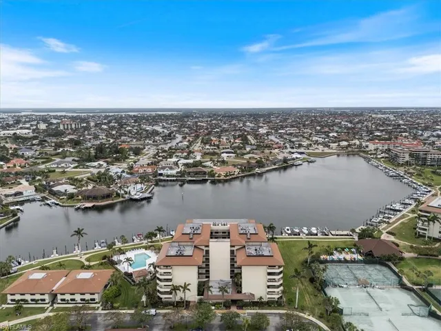 an aerial view of a house with a table and chairs