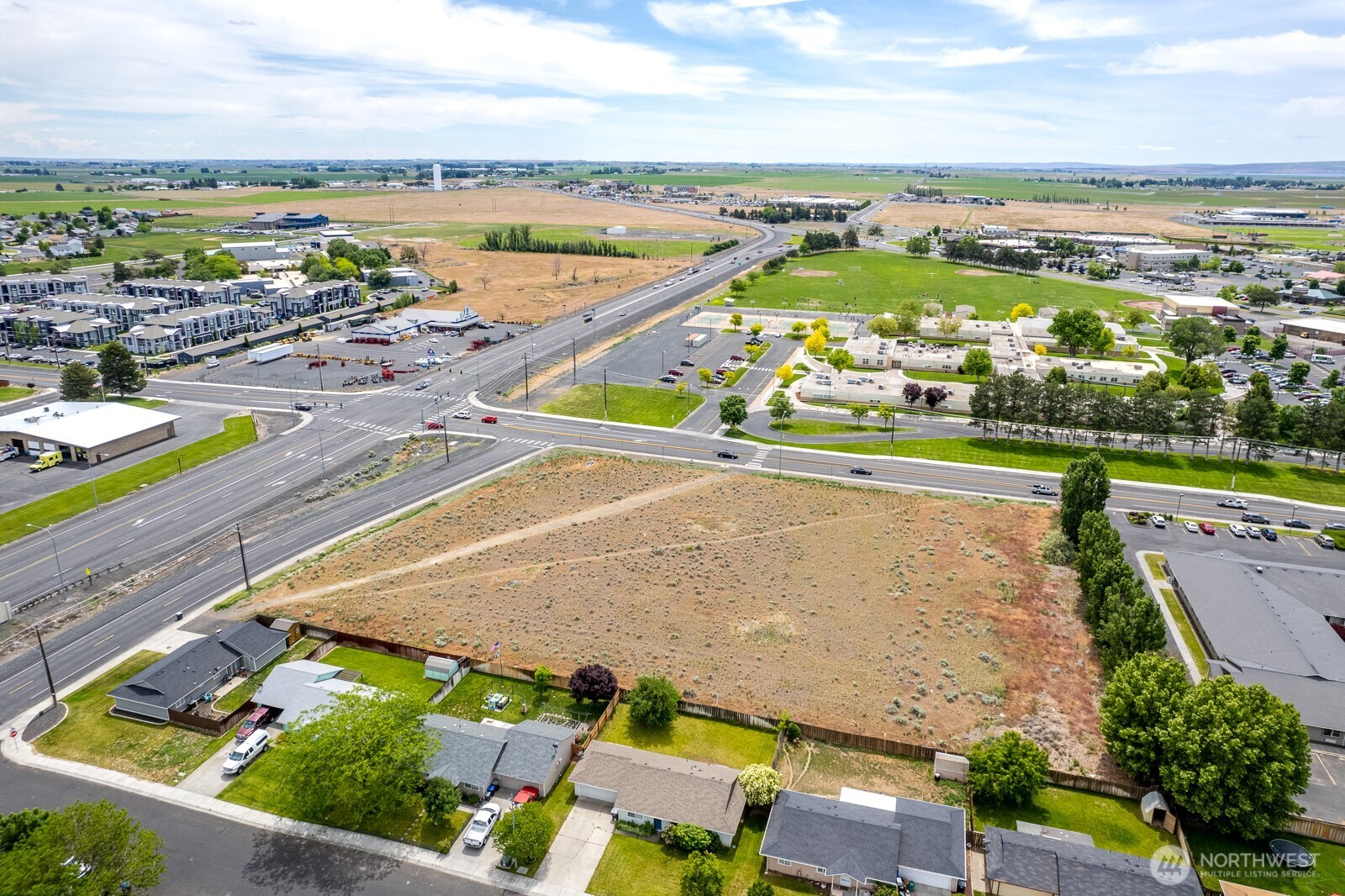 0 Nelson Moses Lake Moses Lake, WA 98837 - Photo 8 of 24 an aerial view of a city with lots of residential buildings and ocean view in back