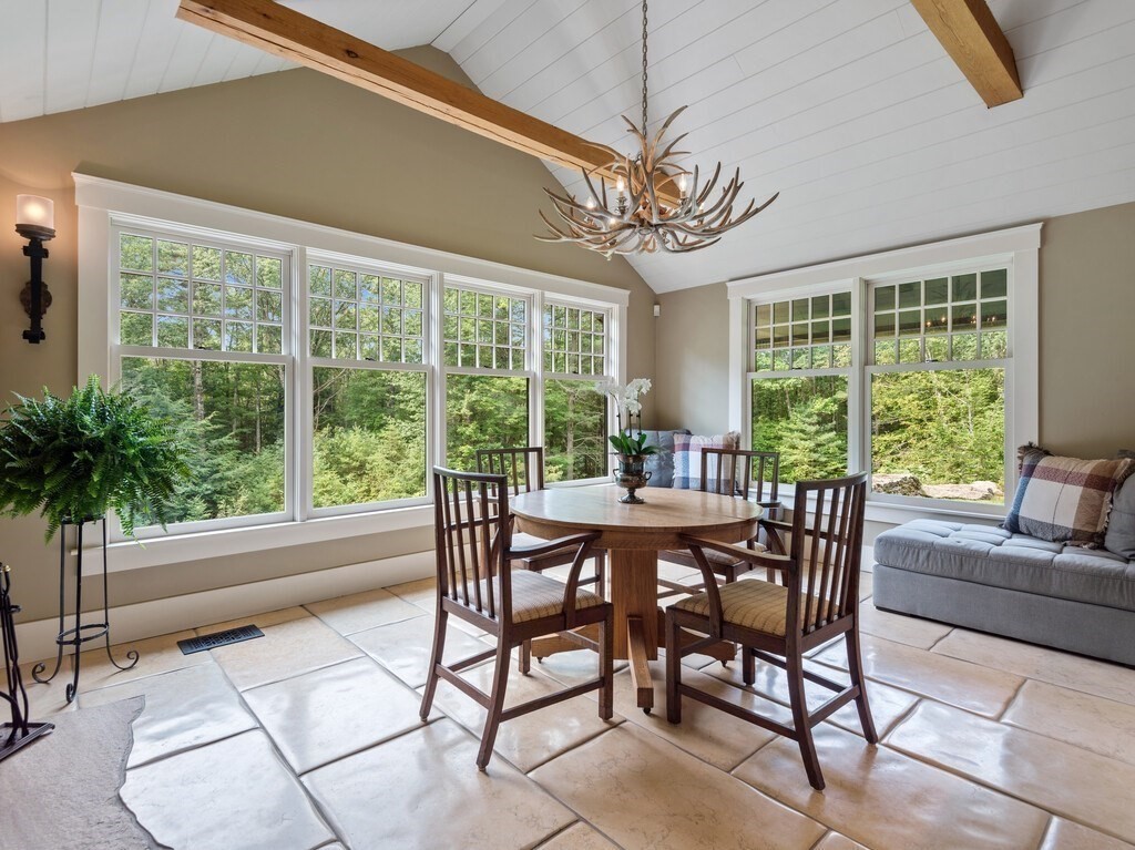 49 Greene Road Princeton, MA 01541 - Photo 16 of 42 a dining room with furniture a chandelier and a rug