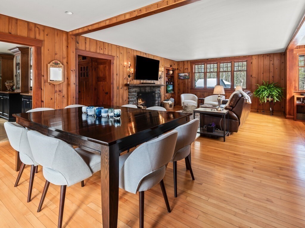 49 Greene Road Princeton, MA 01541 - Photo 18 of 42 a dining room with furniture a fireplace and wooden floor