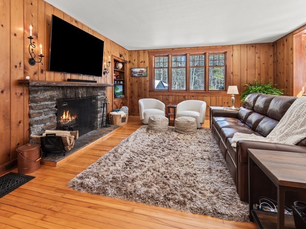 49 Greene Road Princeton, MA 01541 - Photo 19 of 42 a living room with furniture fireplace and flat screen tv