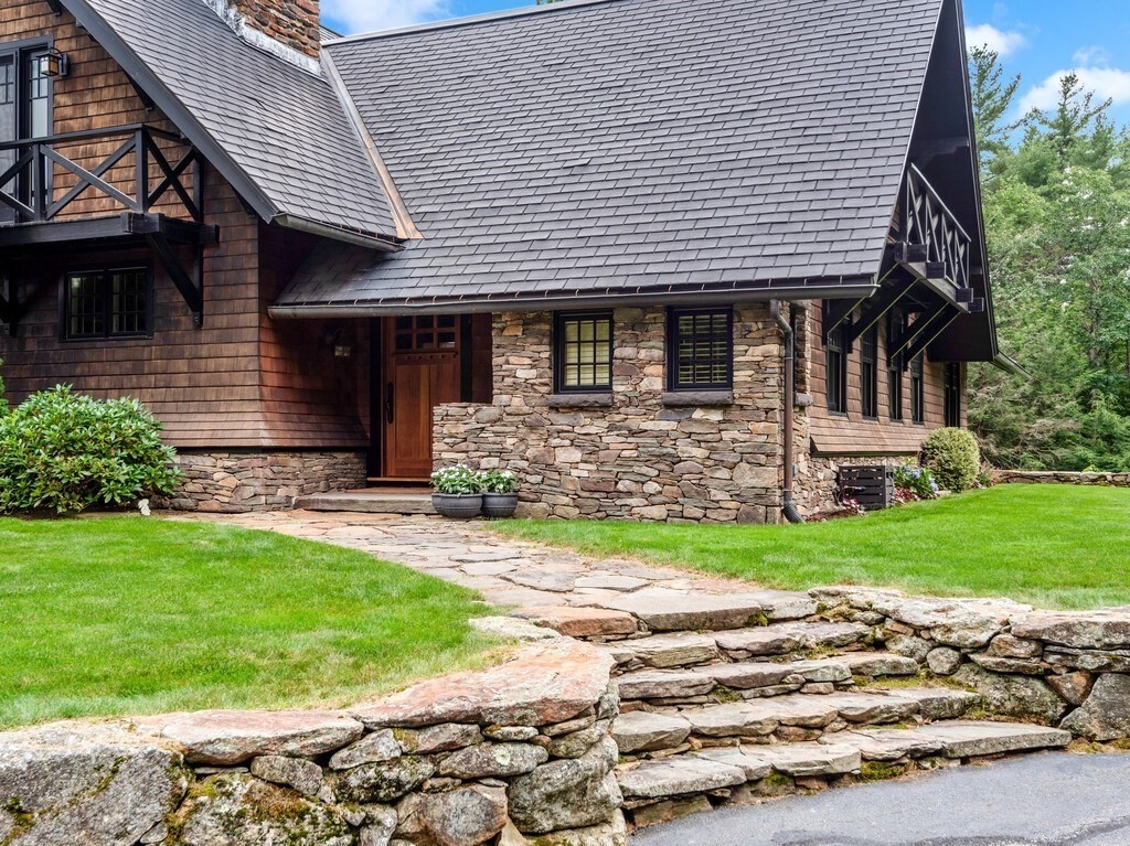 49 Greene Road Princeton, MA 01541 - Photo 2 of 42 a front view of a house with a garden and yard