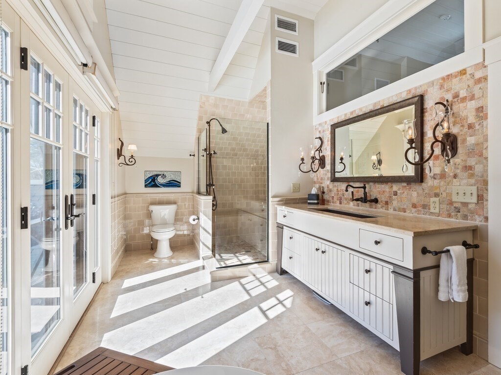 49 Greene Road Princeton, MA 01541 - Photo 29 of 42 a bathroom with a double vanity sink and a mirror