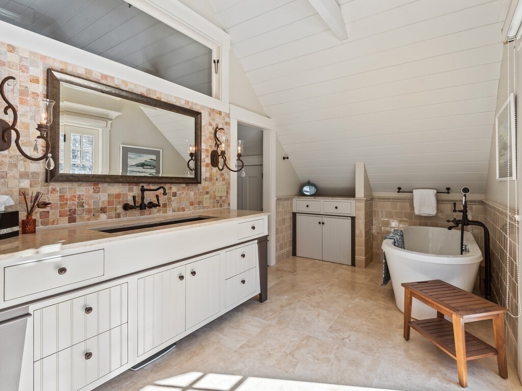 49 Greene Road Princeton, MA 01541 - Photo 30 of 42 a spacious bathroom with a double vanity sink and a mirror