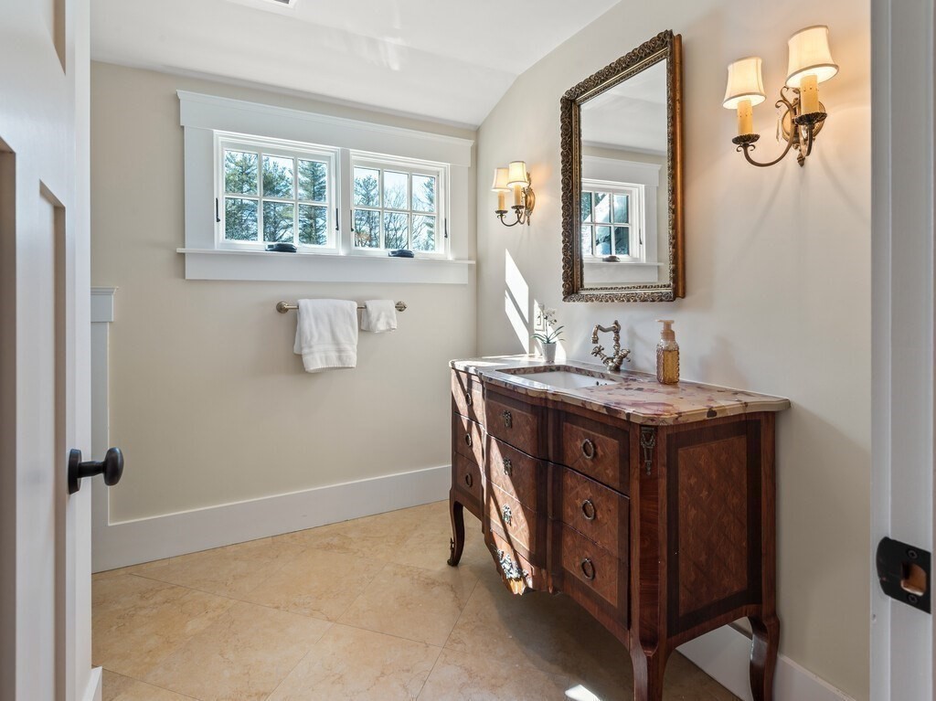 49 Greene Road Princeton, MA 01541 - Photo 32 of 42 a bathroom with a granite countertop sink and a mirror