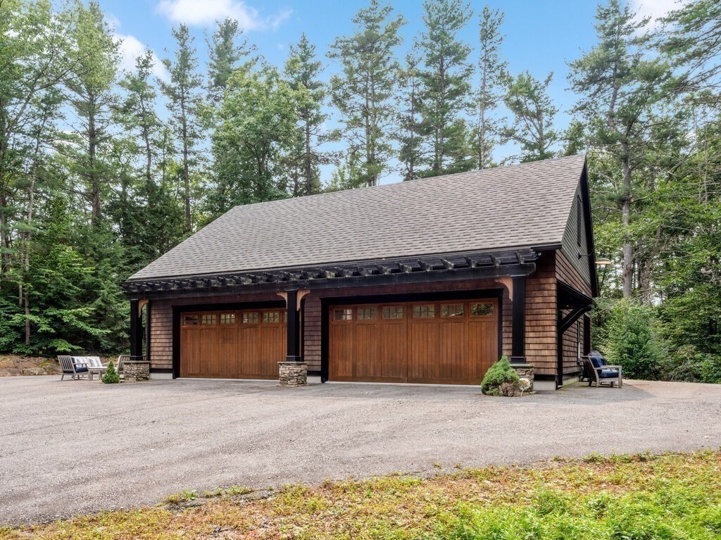 49 Greene Road Princeton, MA 01541 - Photo 35 of 42 a front view of a house with a yard and garage