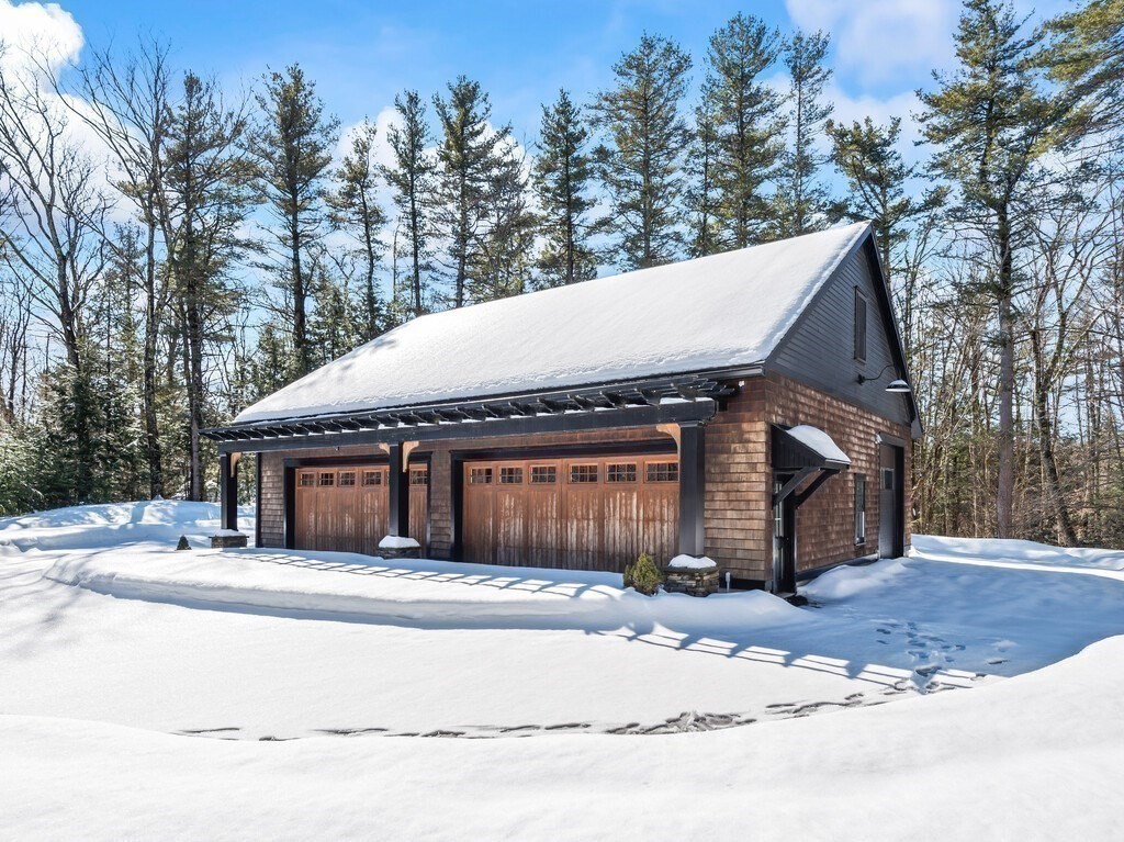 49 Greene Road Princeton, MA 01541 - Photo 36 of 42 a front view of a house with a yard and garage