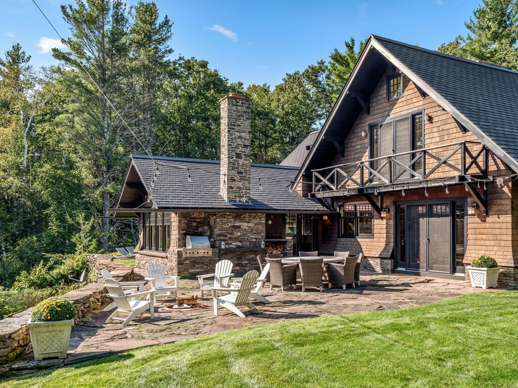 49 Greene Road Princeton, MA 01541 - Photo 40 of 42 a front view of a house with garden and sitting area