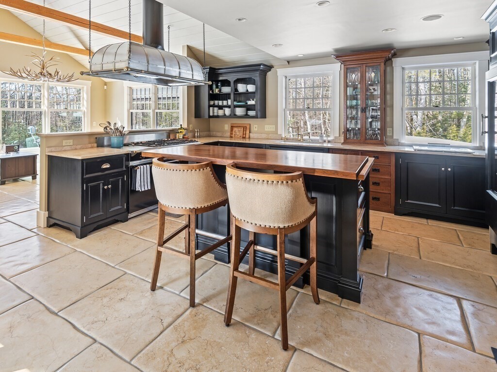 49 Greene Road Princeton, MA 01541 - Photo 7 of 42 a kitchen with stainless steel appliances granite countertop a table chairs and a sink