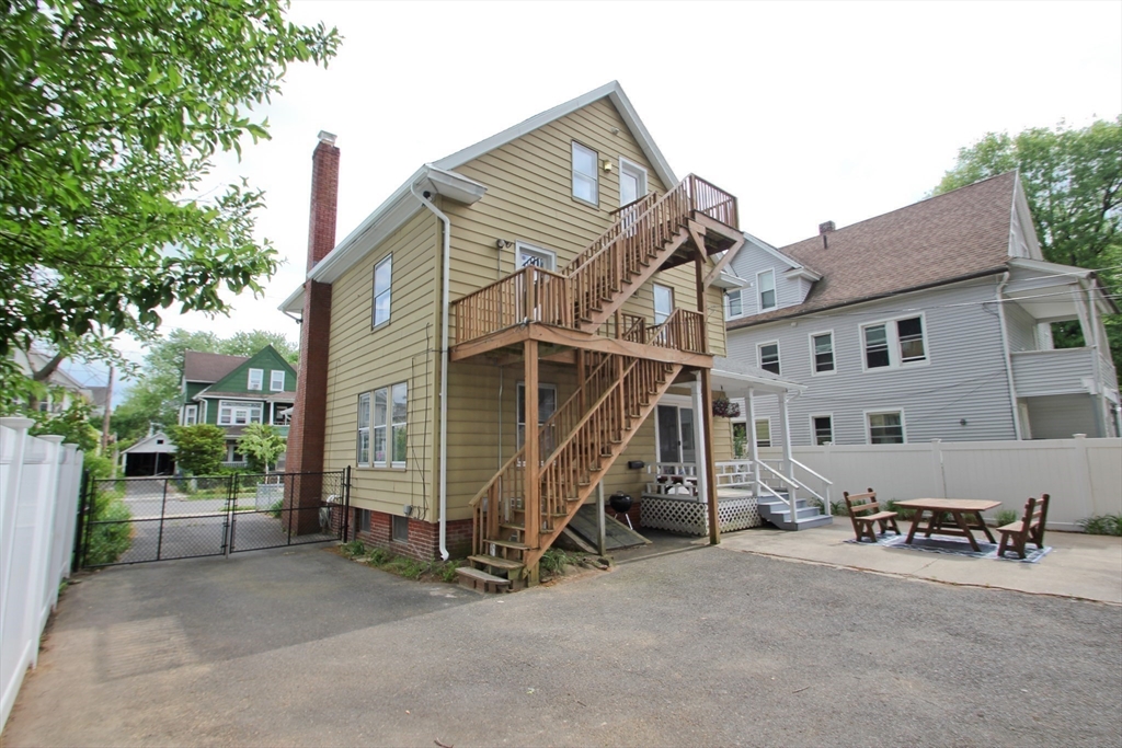 38 Virginia Street Springfield, MA 01108 - Photo 37 of 42 a view of a house with a yard